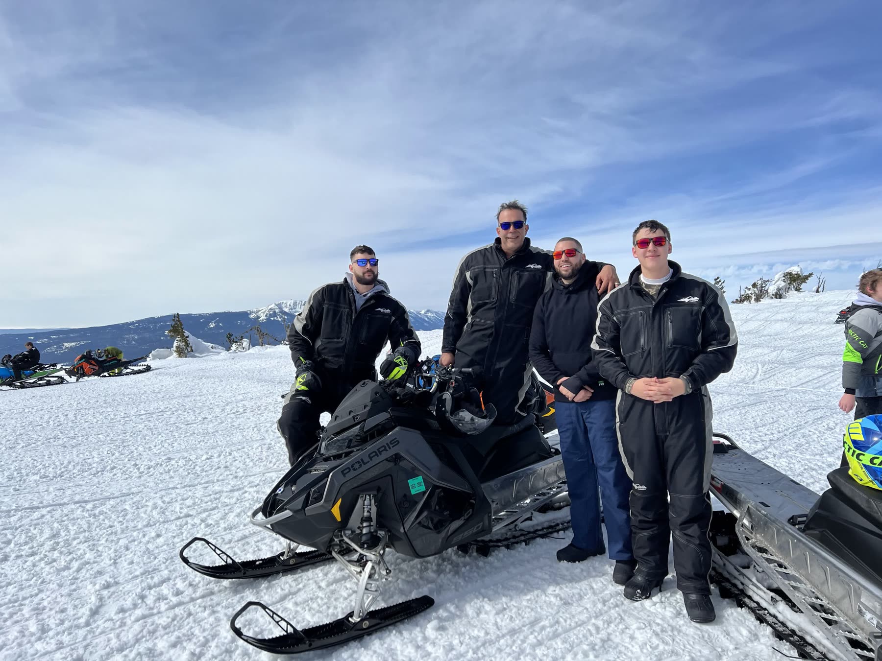 The crew lined up with their sleds on an open snowfield
